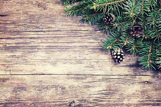 istock Christmas fir tree on a wooden background 485824478