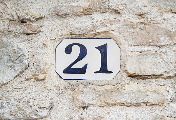 istock Number twenty one  on the stome wall 485825260