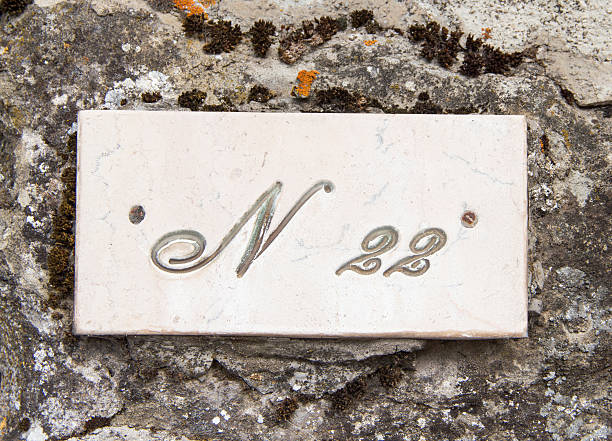 istock Number twenty two on the grey stone wall 485826228