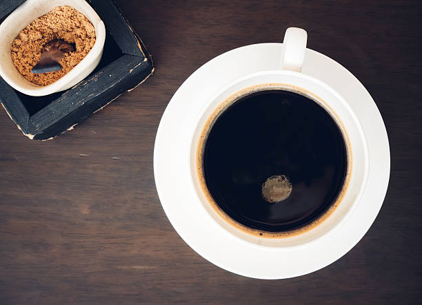 Black coffee with sugar in a cup