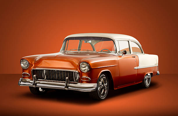 Vintage 1955 Chevrolet Bel Air - Orange Background A vintage 1955 Chevrolet Bel Air isolated with a clipping path on a orange background. bel air photos stock pictures, royalty-free photos & images