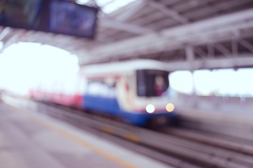 Blurred of BTS skytrain arrives to terminal station