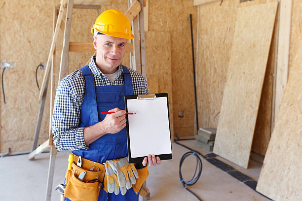foreman pointing at folder plate portrait of foreman pointing at white folder plate Contractor’s License .