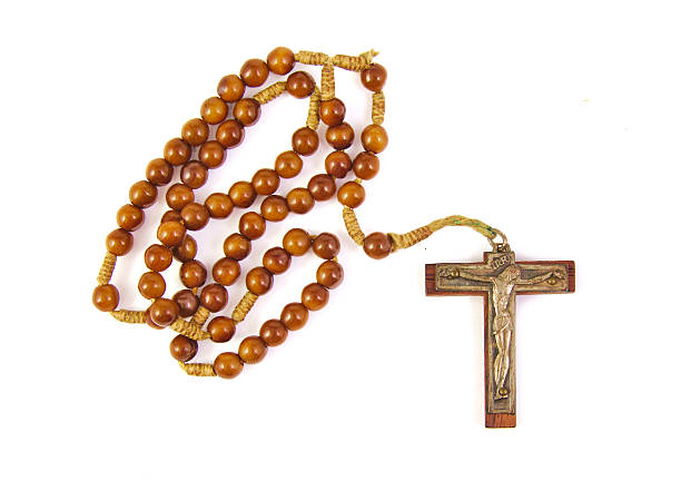 istock Wooden rosary with cross isolated on a white background 485829844