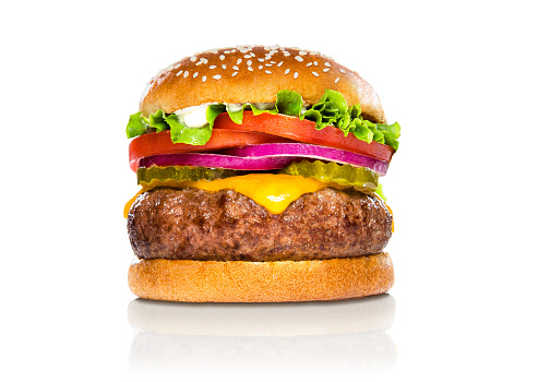 Perfect hamburger classic burger american cheeseburger isolated hamburger with sesame seed bun and extra toppings of tomatoes pickles onion and cheddar cheese