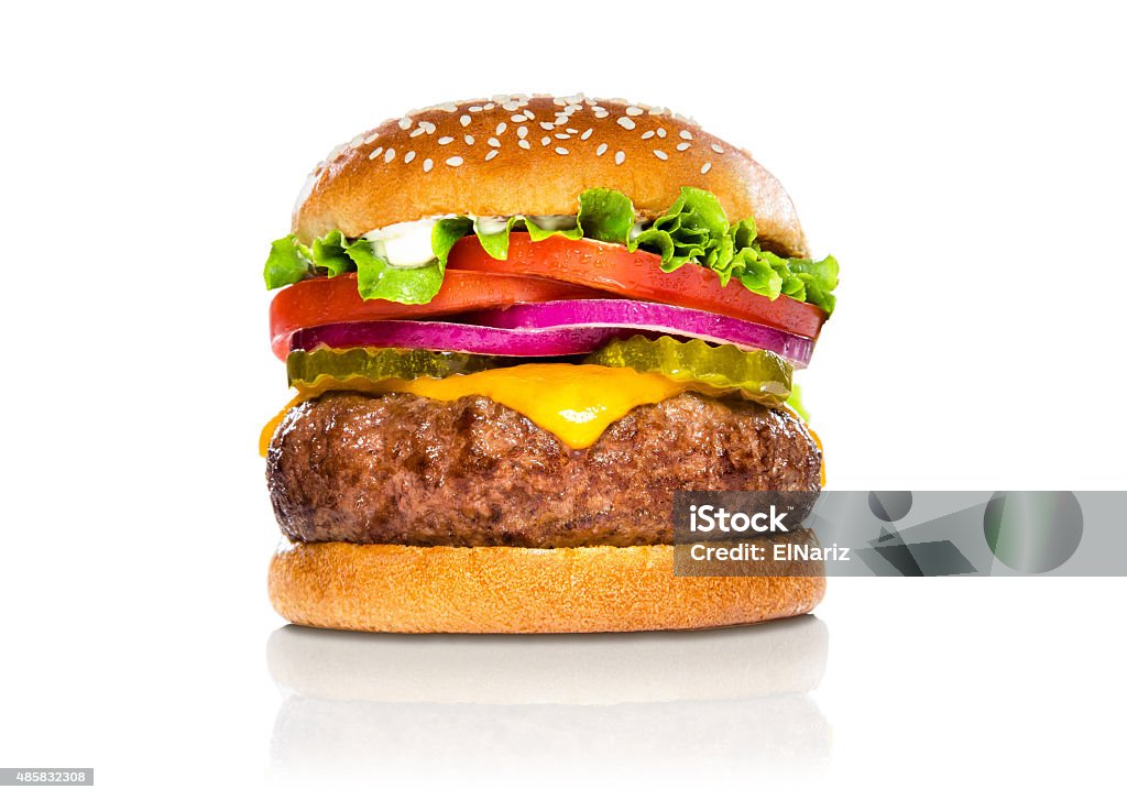 Giant perfect burger large massive thick classic american cheeseburger white Perfect hamburger classic burger american cheeseburger isolated hamburger with sesame seed bun and extra toppings of tomatoes pickles onion and cheddar cheese Burger Stock Photo