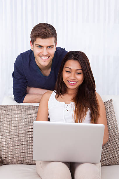 istock Couple With Laptop In Living Room 485832432