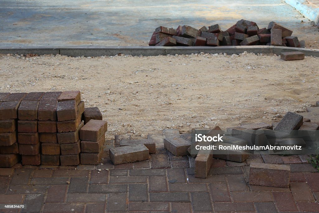 Sidewalk Renovation Pavement renovation , Sidewalk rebuilding.  Paving stone blocks. Close up on a dismantled  paving stone blocks in a working area. Construction of a paving stones sidewalk.  2015 Stock Photo