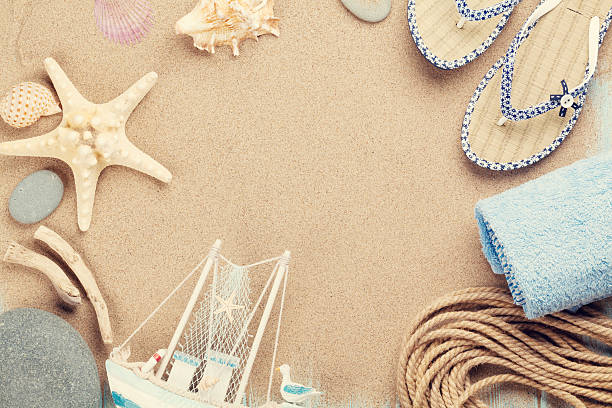 istock Travel and vacation items on sea sand 485835014