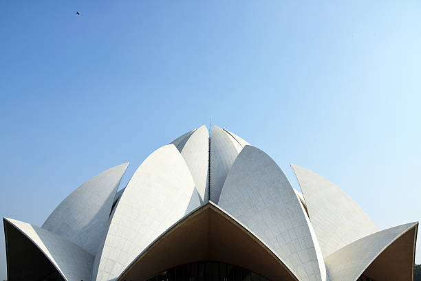 Background of The Lotus Temple (Bahai House of Worship) Background of The Lotus Temple (Bahai House of Worship) located in New Delhi India with Blue Sky  white lotus stock pictures, royalty-free photos & images