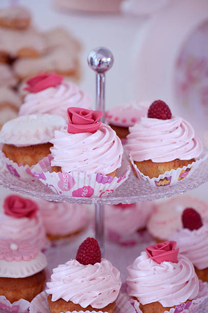 istock Delicious cupcakes with berries and flowers 485835576