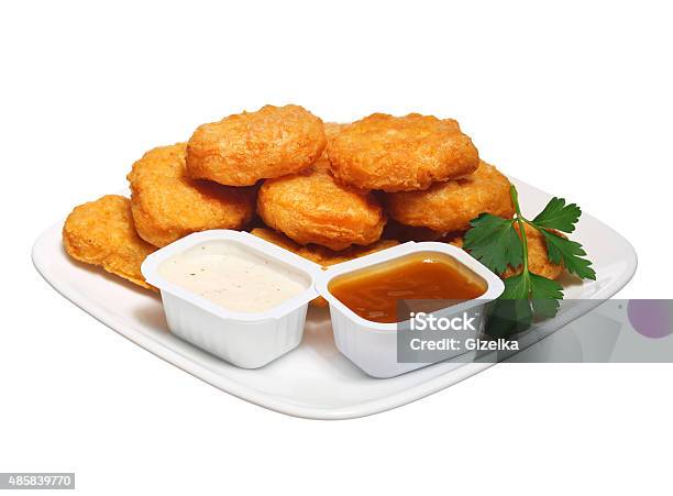 Chicken Nuggets In Plate With Two Dressings Isolated Stock Photo - Download Image Now