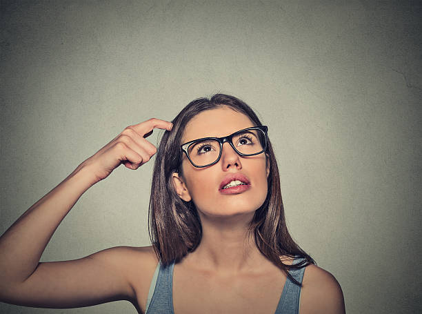 istock woman scratching head thinking daydreaming about something 485841430