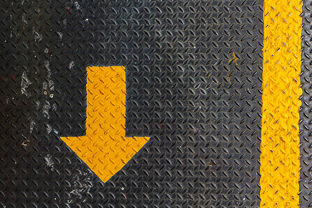 istock Direction arrow on metal sheet floor 485841498