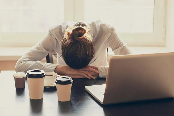 Tired businesswoman in the office