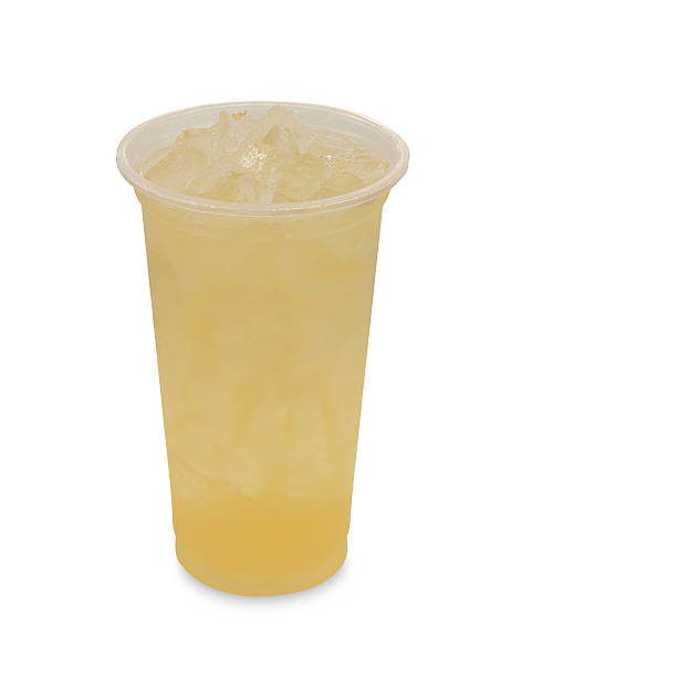 istock ice green tea with lemon in takeaway glass on white 485842642