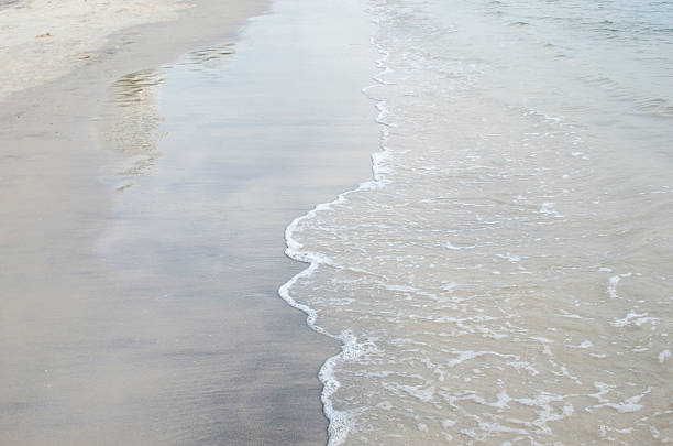 istock soft wave of the sea on the sandy beach 485844094