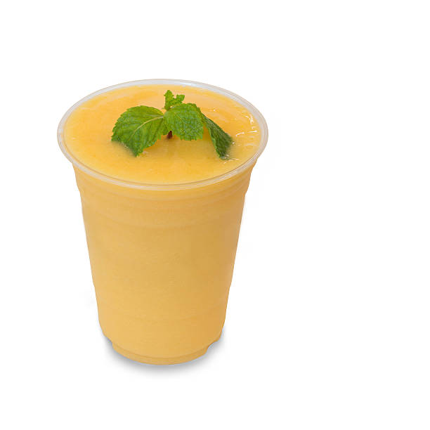 istock cold fresh mango smoothie in takeaway glass isolated on white 485844098