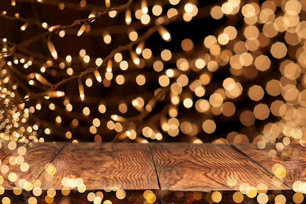 istock wooden table with yellow bokeh on background 485844562