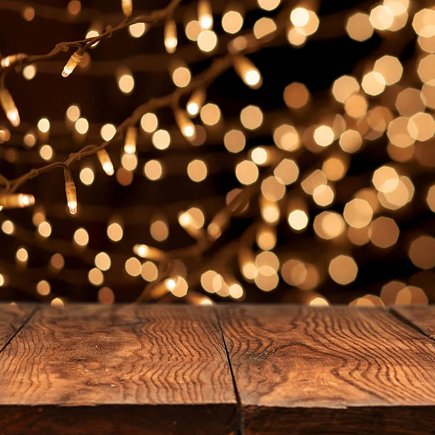 istock wooden table with yellow bokeh on background 485844742