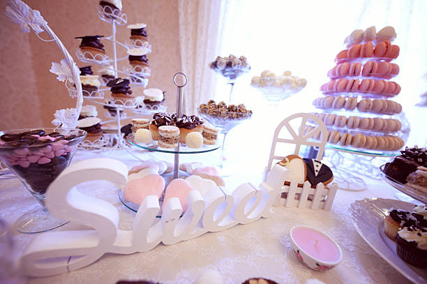 istock Delicious small cakes on beautifully decorated wedding table 485844782