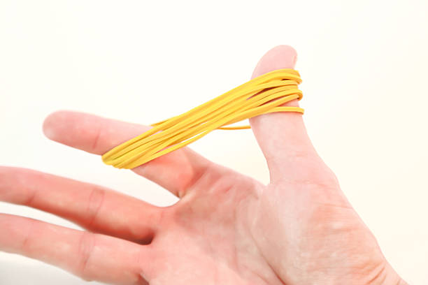 istock Rubber bands for office isolated on white background and handheld 485847164