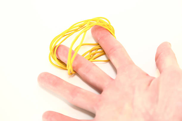 istock Rubber bands for office isolated on white background and handheld 485847244