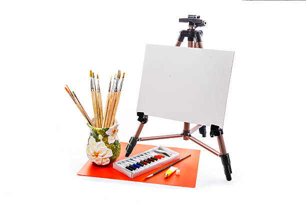 istock Easel with a blank canvas, and brush left krastki 485847338