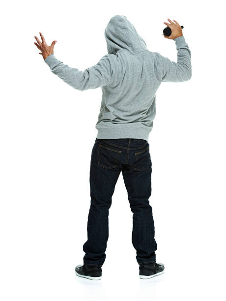 istock Rear view of male rapper with microphone 485849539