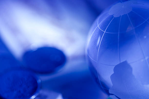 istock Crystal globe and cash on financial statements 485849765