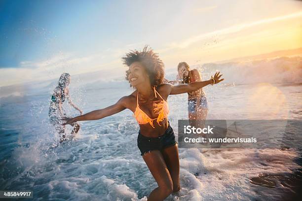 Group Of Friends At The Beach Stock Photo - Download Image Now - Beach, Friendship, Teenage Girls