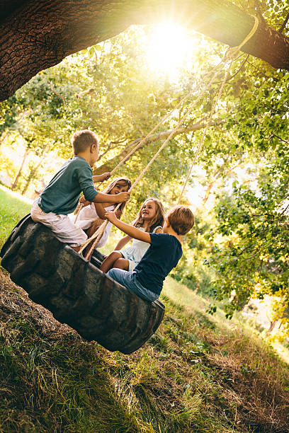 istock Group of kids swinging 485850135