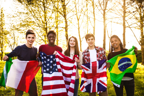 Group of teenager with national flags.