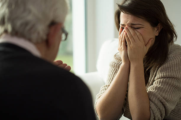 istock Young woman crying during therapy 485850614