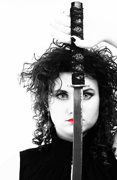 istock piercing woman curly girl and sword 485850625