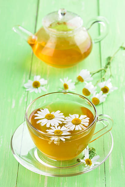 istock Cup of tea with chamomile flowers 485851060