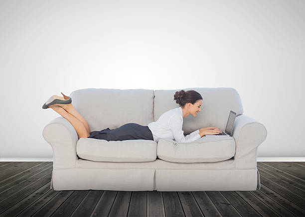 istock Attractive businesswoman lying on a couch 485851339