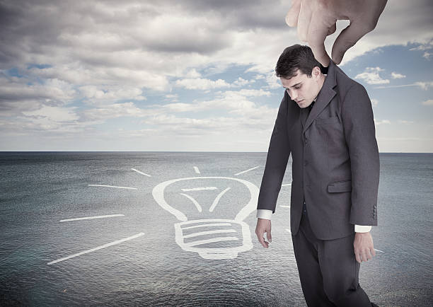 istock Giant hand dropping off businessman on a surface 485851721