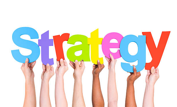 istock Multi-Ethnic Hands Holding Colorful Letters To Form Strategy 485851847