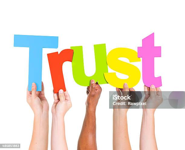 Diverse People Holding Single Word Trust Stock Photo - Download Image Now - Adult, Agreement, Arms Raised