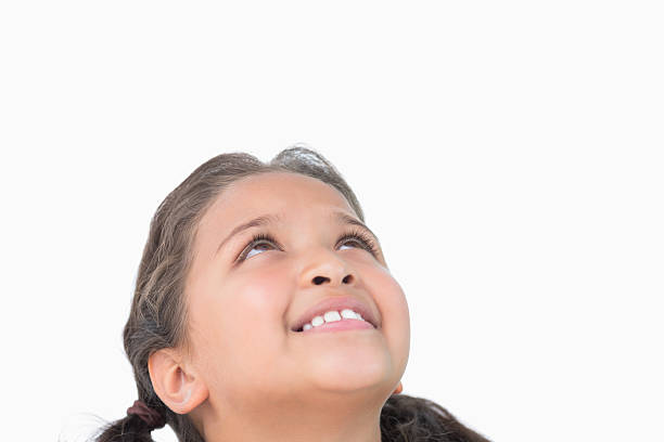 istock Little girl looking up 485851905