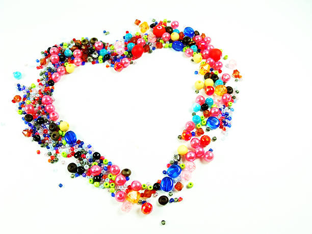 istock colorful beads heart shape space for photo or text 485852934