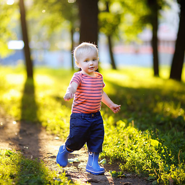 istock Toddler boy running in the park 485853440