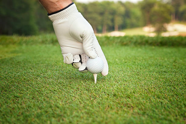 istock Selective focus of golfer's hand placing ball on tee 485854006