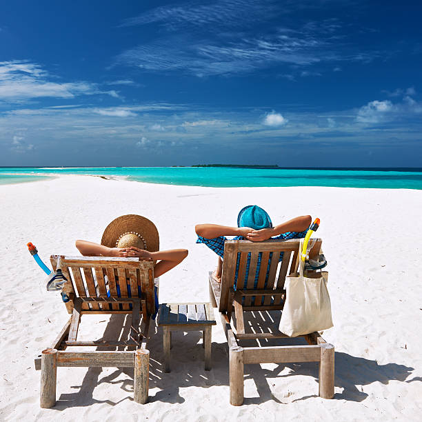 istock Couple relax on a beach at Maldives 485854055