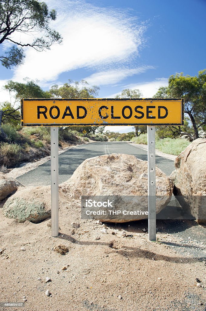 Road Closed Sign Road closed sign with large boulders on the road Dead End Sign Stock Photo