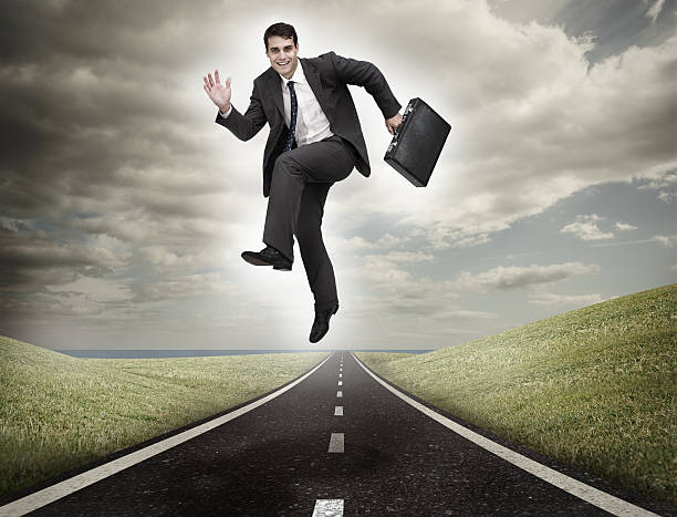 istock Businessman jumping on a road 485854401