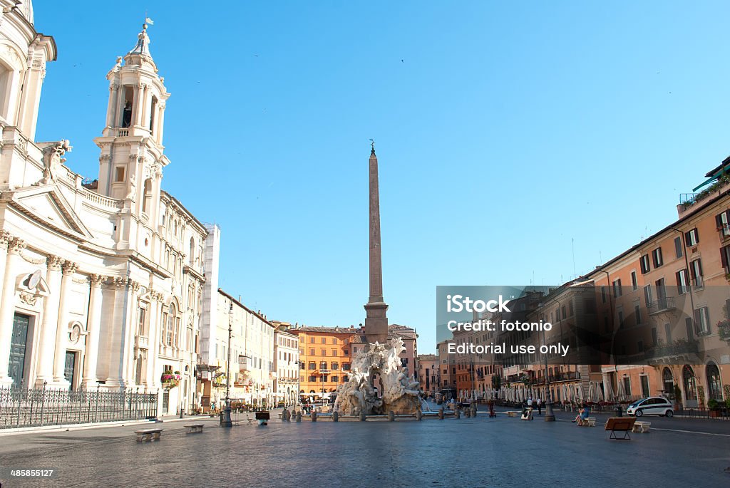 Navona Square Rome, Italy - June 16, 2012: View of Piazza Navona in Rome during a sunny earky morning of summer with fex people walking around the square Architecture Stock Photo