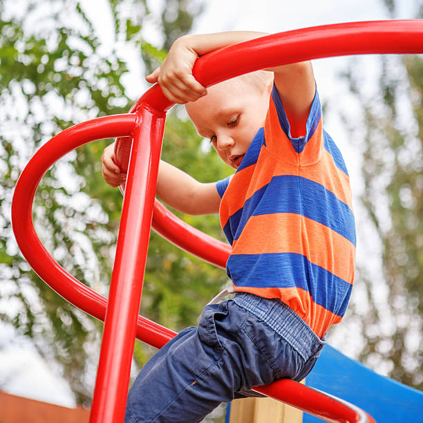 istock Cute little boy playing on the playground in the summer 485857106
