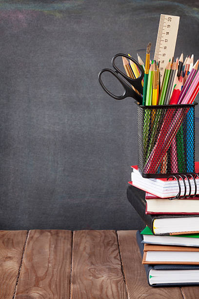 istock School and office supplies on classroom table 485858518